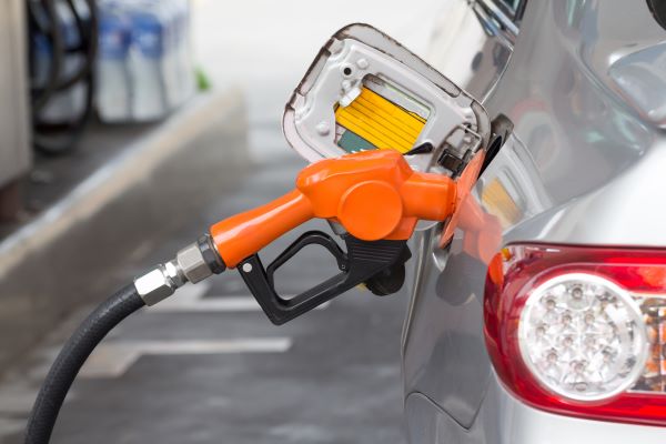 Pumping gas into a car reminds us of high fuel prices and the need for tips to same on gas